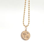 Gold moon and stars disc pendant